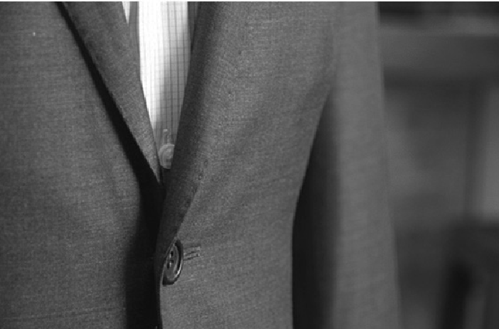 Close up of hand-stitched suit lapel